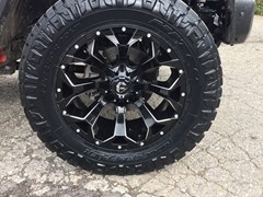 2018 Jeep Wrangler JL with 2.5 Rough Country lift kit and 20x9 Fuel Offroad Assault wheels with 35 inch Nitto Ridge Grappler tires and Rough Country nerf bars and Rough Country LED light bar and pod lights