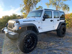 Jk  with a 4in. Zoneoffroad Kit, 20x10 Motometal Gloss Black 970’s, 37x12.50x20 Nitto Ridge Grapplers