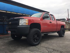 2008 Chevy Silverado with a 6.5 inch Zone Offroad lift kit and 20x9 KMC XD Rockstar 3 wheels with 35 inch Nitto Ridge Grappler tires