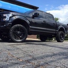 2015 Ford F-150 with 6 inch BDS lift kit, 22 inch KMC XD Rockstar 2 wheels and 35 inch Nitto Trail Grappler tires with a Borla Atak exhaust