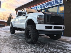 2008 Ford F-250 with 6 inch Zone Offroad lift kit and 20x10 Fuel Offroad Maverick wheels with 38 inch Nitto Trail Grappler tires.  3M satin black vinyl wrapped on grille, hood, rood, and tailgate.