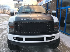 2008 Ford F-250 with 6 inch Zone Offroad lift kit and 20x10 Fuel Offroad Maverick wheels with 38 inch Nitto Trail Grappler tires.  3M satin black vinyl wrapped on grille, hood, rood, and tailgate.