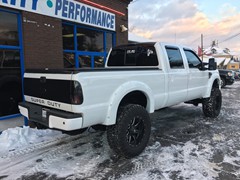 2008 Ford F-250 with 6 inch Zone Offroad lift kit and 20x10 Fuel Offroad Maverick wheels with 38 inch Nitto Trail Grappler tires.  3M satin black vinyl wrapped on grille, hood, rood, and tailgate.