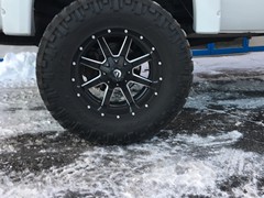 2008 Ford F-250 with 6 inch Zone Offroad lift kit and 20x10 Fuel Offroad Maverick wheels with 38 inch Nitto Trail Grappler tires.  3M satin black vinyl wrapped on grille, hood, rood, and tailgate.