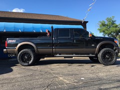 2016 Ford F-350 with 4 inch Zone Offroad lift kit with Fox shocks, 22 inch KMC XD820 Grenade wheels with 37 inch Toyo Open Country MT tires, DeeZee tool box and headache rack and Heise and Hella LED lights