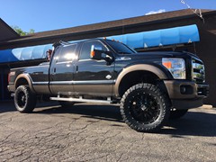 2016 Ford F-350 with 4 inch Zone Offroad lift kit with Fox shocks, 22 inch KMC XD820 Grenade wheels with 37 inch Toyo Open Country MT tires, DeeZee tool box and headache rack and Heise and Hella LED lights