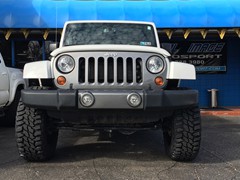 2013 Jeep Wrangler with a 4 inch Zone Offroad lift kit and 20x10 KMC XD Monster wheels and 35 inch Mastercraft MXT tires