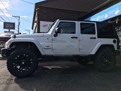 2013 Jeep Wrangler with a 4 inch Zone Offroad lift kit and 20x10 KMC XD Monster wheels and 35 inch Mastercraft MXT tires