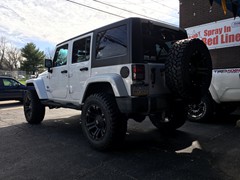 2013 Jeep Wrangler with a 4 inch Zone Offroad lift kit and 20x10 KMC XD Monster wheels and 35 inch Mastercraft MXT tires