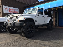 2013 Jeep Wrangler with a 4 inch Zone Offroad lift kit and 20x10 KMC XD Monster wheels and 35 inch Mastercraft MXT tires