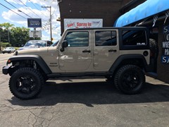 2016 Jeep Wrangler with a 4 inch lift and 20x9 KMC XD Rockstar II wheels and 35 inch Mastercrsft MXT tires