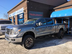 2017 Nissan Titan XD with a 3 inch Rough Country lift kit and 20x9 XD837 wheels with Toyo Open Country AT2 tires 305/55/20