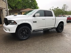 2017 Ram 1500 with 4 inch Zone Offroad lift kit with Fox Adventurer series shocks and 20x10 Fuel Offroad Hostage wheels with 35 inch Nitto Ridge Grappler tires and Bushwacker pocket flares.