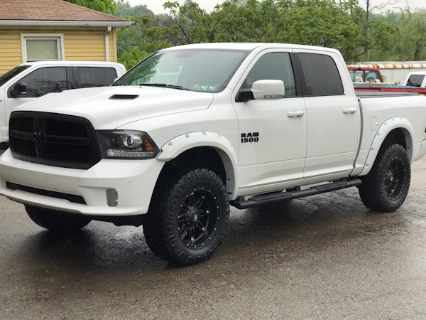 2017 Ram 1500 with 4 inch Zone Offroad lift kit with Fox Adventurer series shocks and 20x10 Fuel Offroad Hostage wheels with 35 inch Nitto Ridge Grappler tires and Bushwacker pocket flares. 