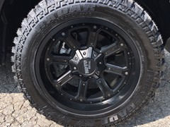 2018 Ram 1500 with 20 inch Moto Metal MO984 wheels and 33 inch Radar Renegade MT tires