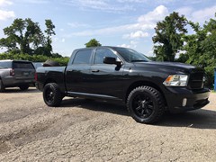 2018 Ram 1500 with 20 inch Moto Metal MO984 wheels and 33 inch Radar Renegade MT tires