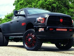 2012 Ram 3500 with full Matte Black vinyl wrap, custom red emblems, 24 inch American Force Dolla wheels (custom painted) with 37x13.50x24 Toyo Open Country MT tires.  Custom made Oracle headlights, Fog Lights, and LED light bar