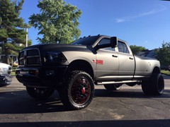 2012 Ram 3500 with full Matte Black vinyl wrap, custom red emblems, 24 inch American Force Dolla wheels (custom painted) with 37x13.50x24 Toyo Open Country MT tires.  Custom made Oracle headlights, Fog Lights, and LED light bar