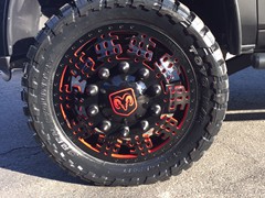 2012 Ram 3500 with full Matte Black vinyl wrap, custom red emblems, 24 inch American Force Dolla wheels (custom painted) with 37x13.50x24 Toyo Open Country MT tires.  Custom made Oracle headlights, Fog Lights, and LED light bar