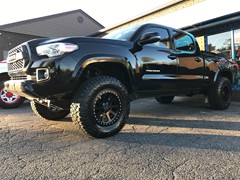 2017 Toyota Tacoma with Readylift SST kit and 17 inch Black Rhino Mint wheels and 285/70/17 Nitto Ridge Grappler tires