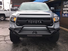 2017 Toyota Tundra TRD Pro with 4 inch Readylift lift with 20 inch Fuel Vapor wheels and 35 inch Nitto Ridge Grappler tires.  Fab Fours Vegance front bumper with Rigid Industries LED light bar and Dually fog lights and Racesport HID kit.  Amp Research 