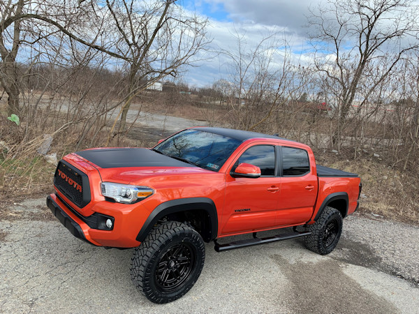 2017 Toyota Tacoma 3in. Rough Country Lift, 20x9  +0 Fuel Nitro’s , 285/50/20 Nitto Ridge Grapplers, Flat black wrapped hood, roof, and tailgate, custom grill , smoked tail lights 