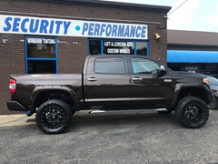 2018 Toyota Tundra with a 6in. RoughCountry Lift, 20x10 Fuel Kranks,35x12.50x20 Nitto Ridge Grapplers and Custom Painted Bushwacker pocket flares