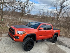 2017 Toyota Tacoma 3in. Rough Country Lift, 20x9  +0 Fuel Nitro’s , 285/50/20 Nitto Ridge Grapplers, Flat black wrapped hood, roof, and tailgate, custom grill , smoked tail lights