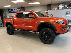2017 Toyota Tacoma 3in. Rough Country Lift, 20x9  +0 Fuel Nitro’s , 285/50/20 Nitto Ridge Grapplers, Flat black wrapped hood, roof, and tailgate, custom grill , smoked tail lights